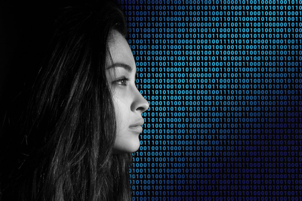 Woman over background of code